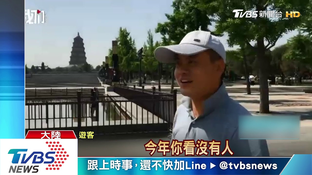 拚經濟也防疫　陸景區員工戴「1公尺帽」迎客