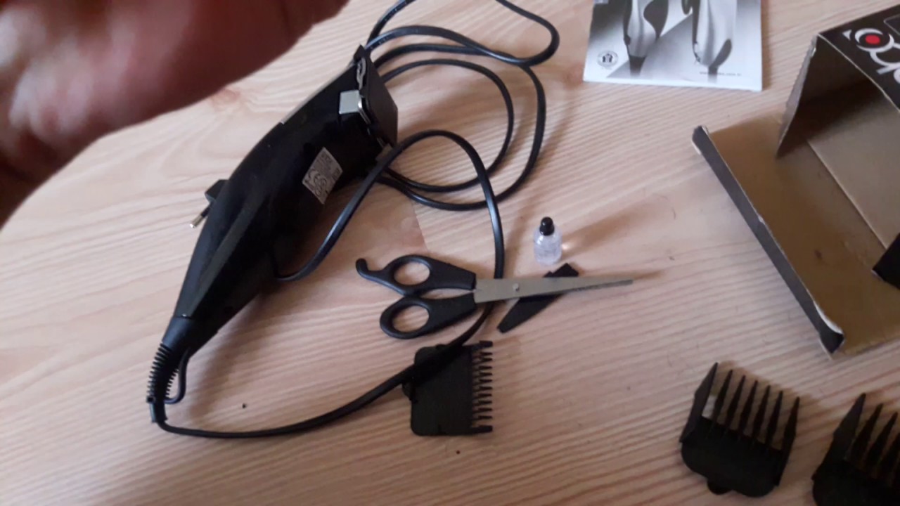 Машинка для стрижки Sinbo SHC 4350 серебристый/черный (насадок в компл:4шт)