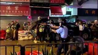 video: Hong Kong police officer 'fires warning shot' amid fresh clashes with protesters