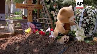 Flowers laid on the coffin of murdered journalist