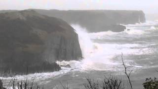 waves at the headlands today during the storm .