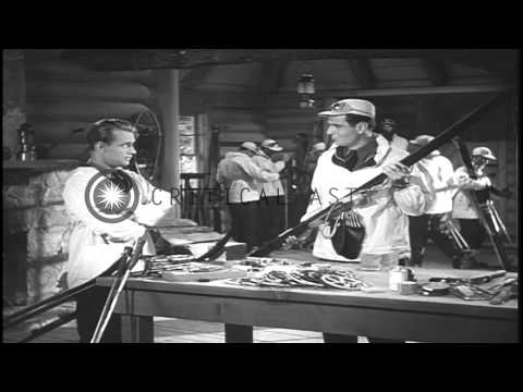 An officer demonstrates the application of wax on a ski in the United States. HD Stock Footage