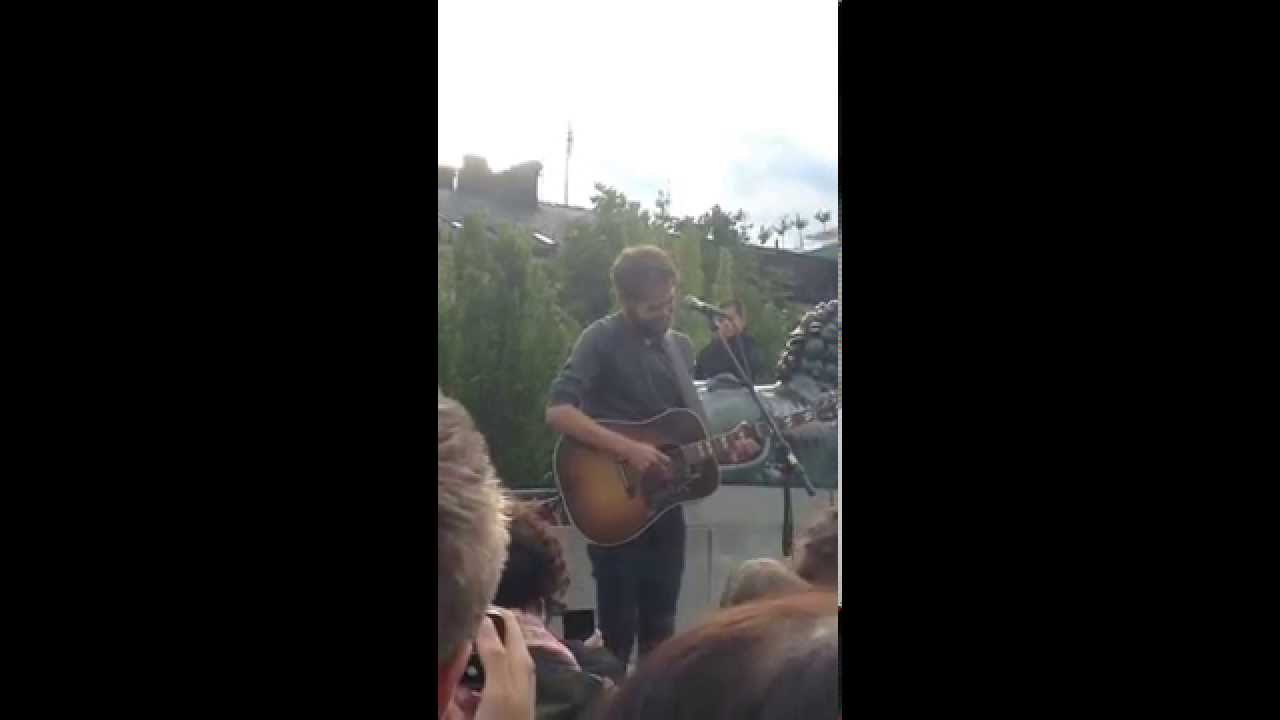 Random man gives Passenger (Mike Rosenberg) money.