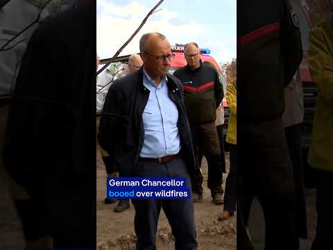German Chancellor Merz booed during wildfire town visit | DW News