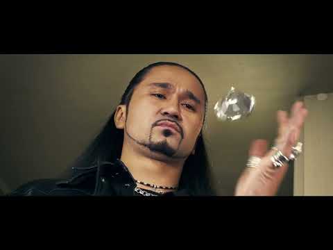 Trailer frame with silhouetted figures on a pier; the score-compilation blend suggests looming confrontation