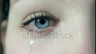 stock footage tears in a female girl sad eye in p