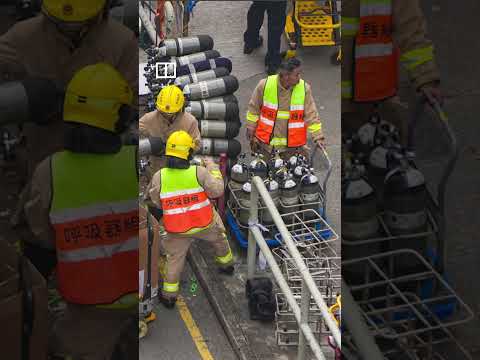 Hong Kong firefighters work non-stop to put out deadly blaze