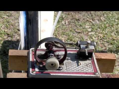 Trash can lid powers a steam engine parabolic mirror