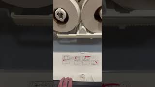 Opening a Tork toilet roll dispenser!
