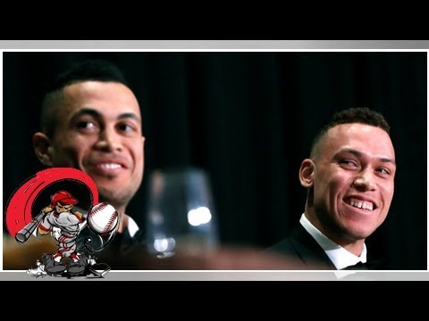 Giancarlo stanton arrives at yankees camp, and the spotlight flips on