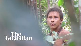Footage of uncontacted tribesman in the Amazon rai
