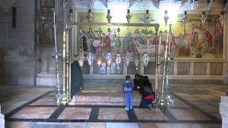 Christians Praying on The Stone of Anointing