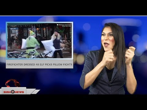 Firefighter dressed as elf picks pillow fights (ASL - 12.7.18)
