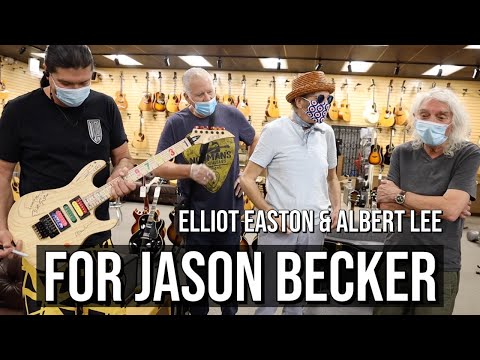 Elliot Easton & Albert Lee signs guitar for Jason Becker at Norman's Rare Guitars