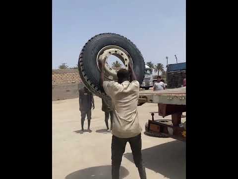 This man put the tyre on the vehicle