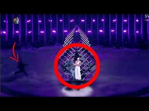 Guy jumps up on eurovision stage - while United Kingdom’s performance