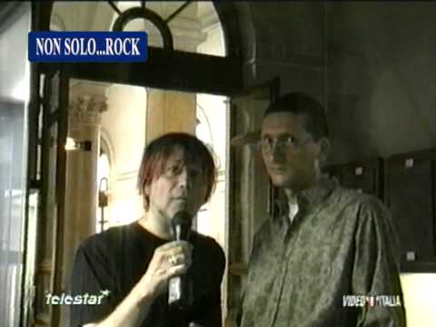 Magross explaining the meaning of the song "Woman" during a television interview (in Italian)