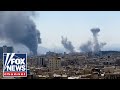 US Launches Nearly 900 Strikes On Iran In RARE Daytime Operation