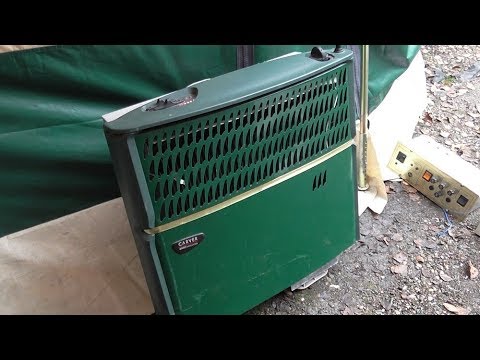 Caravan gas fire with Fanmaster blown air heating unit.