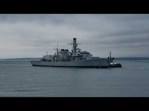 HMS Monmouth  decommissioned  stripped being towed into Portsmouth for the final time.