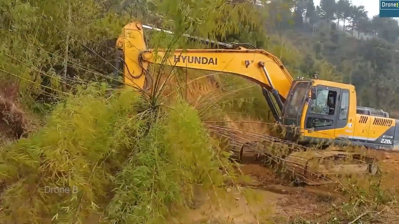 Bamboos and Huge Rocks-Cutting Mountainside for Wider Road-Hyundai Excavator