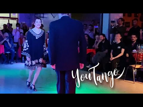  Maria Nieves  and  Oscar Martinez Pey  are  dancing  to  the  tango  "  Oigo Tu Voz  "  by  Ricardo Tanturi  in  2020