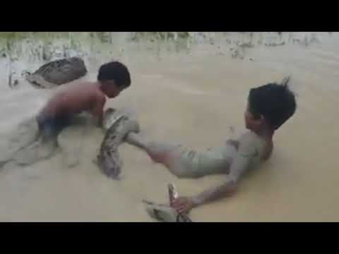 Supernatural children playing with a huge snake