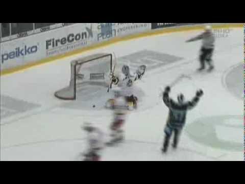 Jonas Junland scores from center ice on Frans Tuohimaa