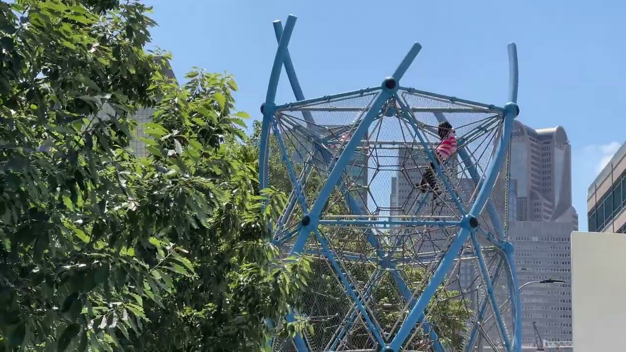 How can you estimate the height of the DNA Tower using yourself?