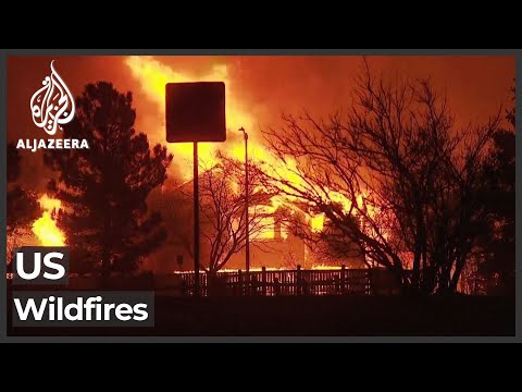 Tens of thousands flee as Colorado fires burn hundreds of homes