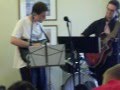 GHEEROT PLAYING GUITAR WITH THE BAND