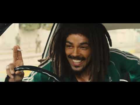 Bob Marley: One Love movie trailer key art with Kingsley Ben-Adir as Bob performing on stage