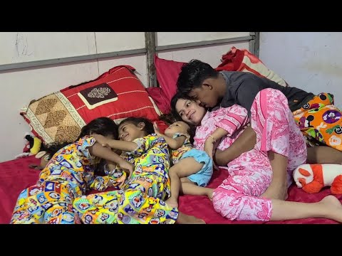 Sweet husband with wife while children are playing together