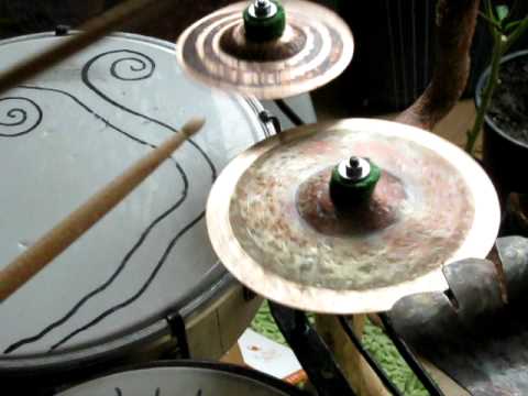 Steve Hubback playing on two very small cymbals
