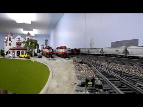 Frisco grain train going past Quanah Acme & Pacific depot