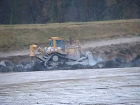 caterpillar D9R pushing rock