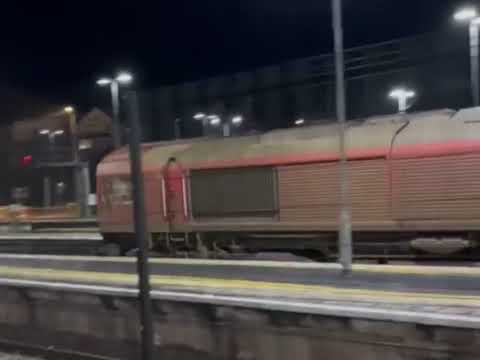 BR Class 66 EWS diesel locomotive hauling track cleaning unit