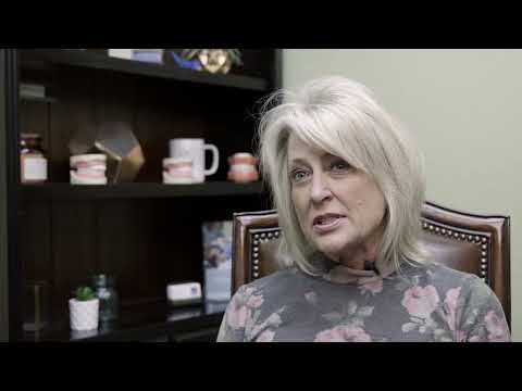 Senior woman sitting in Weatherford dental office