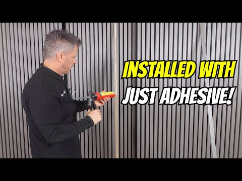 Part of a video titled Installing Wall Panels with Just Adhesive! | 3C Multi-Use - YouTube
