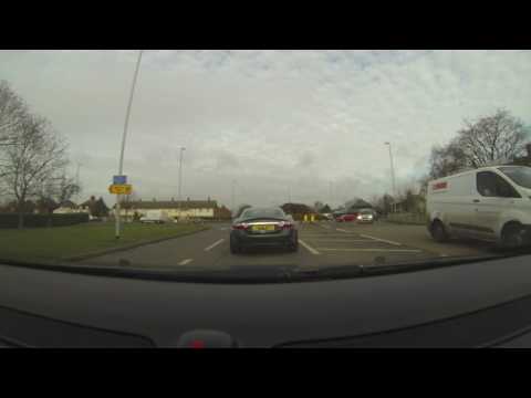 Woman using phone & driving RY53 TVZ Cambridge 10Jan2017