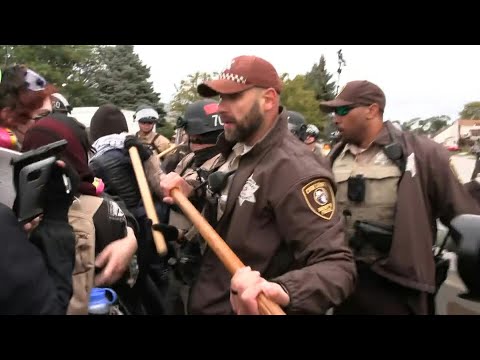 Protesters scuffle with law enforcement outside ICE facility near Chicago | AFP