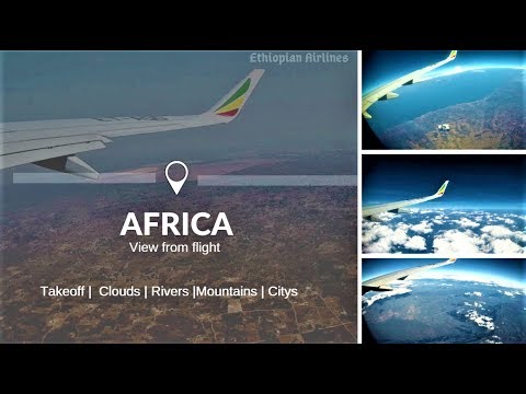 Beautiful View Through Airplane, Flying Above clouds , Rivers , Cities , African mountains Footage