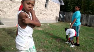 Little kids playing football