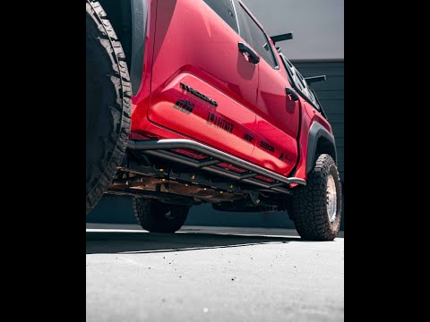 We are loving this Supersonic Red 2024 Tacoma @redhead_jesss built with our New Rock Sliders, Built