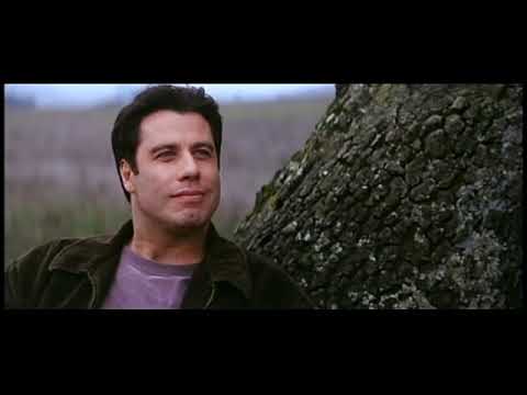 Trailer close-up: Travolta’s George Malley in thoughtful profile as a gentle guitar figure suggests hope