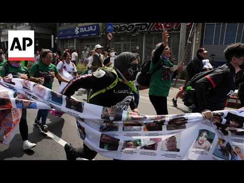 Families of Mexico's missing march for answers as World Cup kicks off