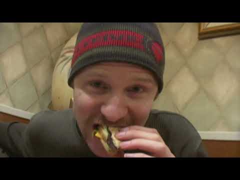 Super Size Me trailer still — fast cuts of burgers, fryers, and nutrition charts