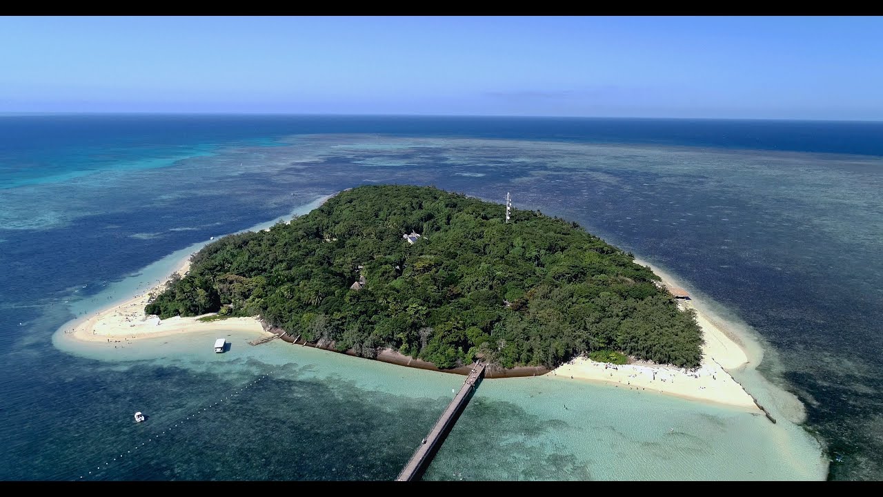 Soar over Green Island and admire its panoramic beauty.