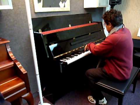 Yamaha LU-11 Console Piano in Polished Ebony being played