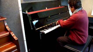 Yamaha LU-11 Console Piano in Polished Ebony being played